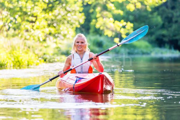 Mujer conducción kayak forestales río deporte Foto stock © Kzenon