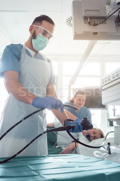 Internist doctors during stomach examination  Stock photo © Kzenon
