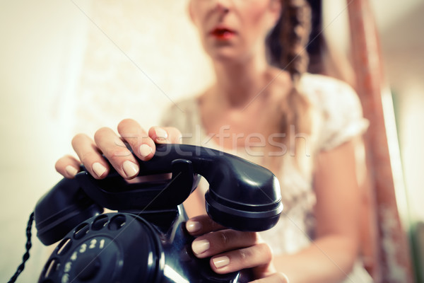 Woman sitting on the stairs and waiting for a call Stock photo © Kzenon