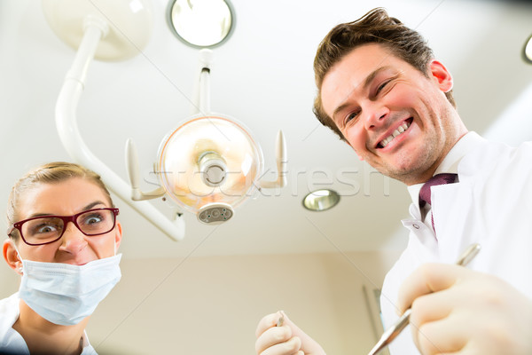 treatment at dentist from perspective of patient Stock photo © Kzenon