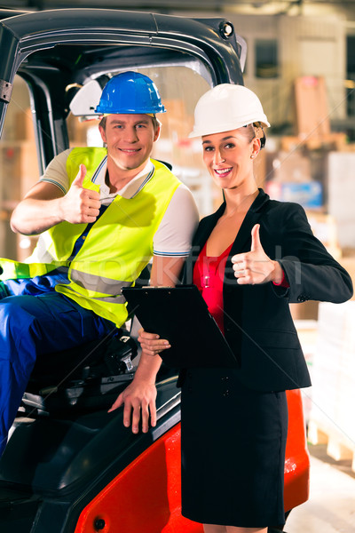 Forklift driver and supervisor at warehouse Stock photo © Kzenon