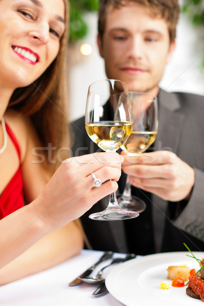 Stock photo: Couple eating and drinking in very good restaurant