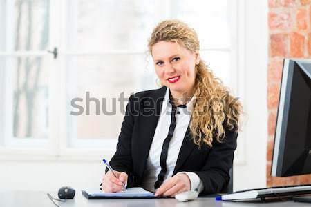 Lawyer in office with law book working on desk Stock photo © Kzenon