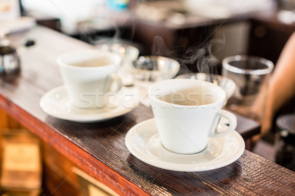 Cups of drip coffee on bar of coffee shop Stock photo © Kzenon