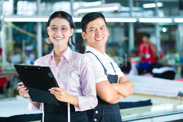 Production manager and designer in Asian factory Stock photo © Kzenon