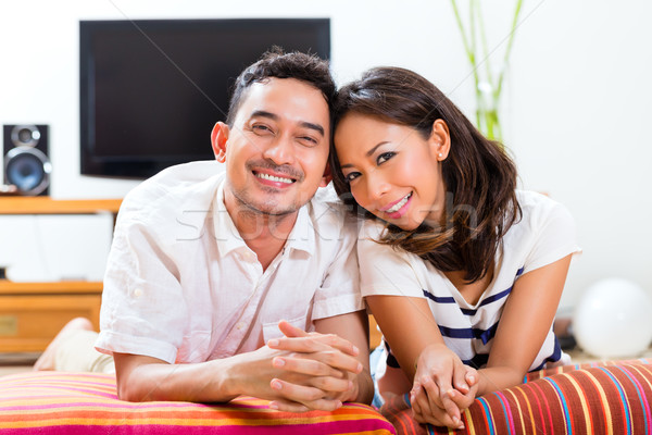 Asian couple at home in their living room Stock photo © Kzenon