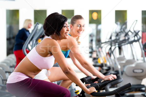 Stock photo: People Spinning in the gym on bicycles