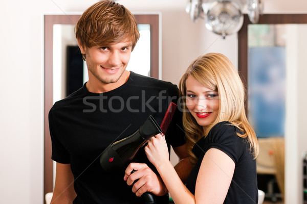 Male and female hairdresser Stock photo © Kzenon