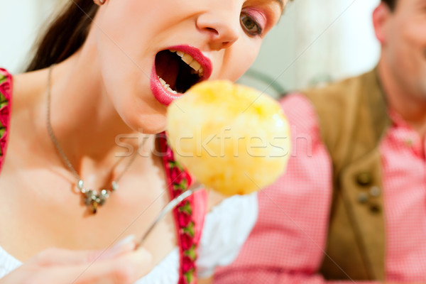 Woman eating dumplings in Bavarian restaurant Stock photo © Kzenon