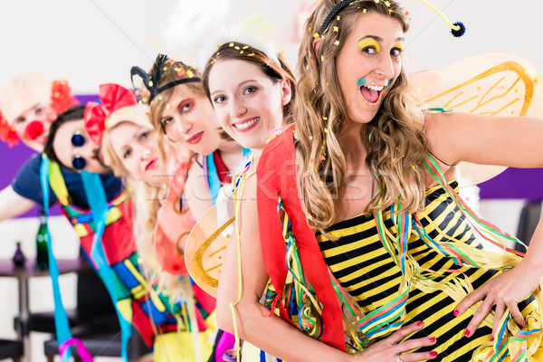 Party people celebrating carnival or new years eve Stock photo © Kzenon