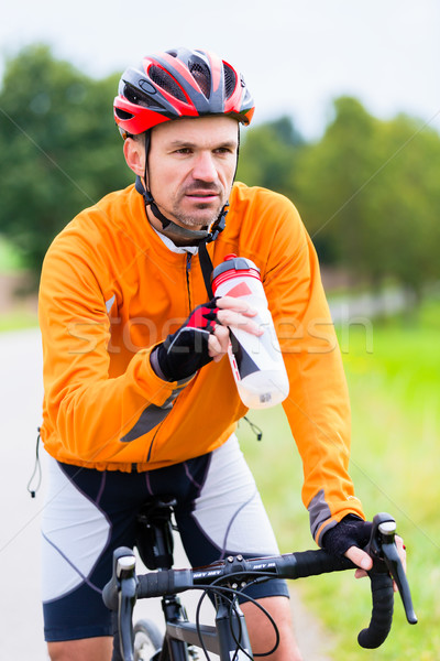 Cyclist on race bike pedaling on bike track Stock photo © Kzenon