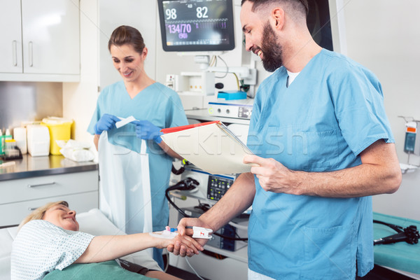 Doctor greeting patient before starting treatment Stock photo © Kzenon