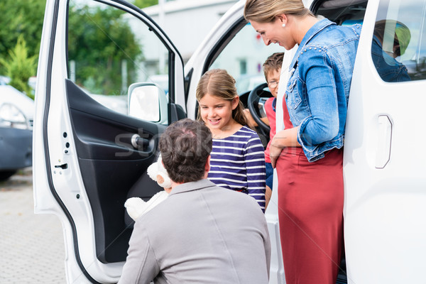 Family buying car, mother, father and child at dealership Stock photo © Kzenon
