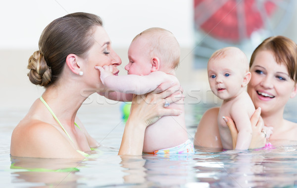 Babies and their mommies at infant swimming course   Stock photo © Kzenon