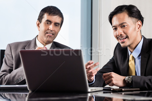 Stock photo: Senior manager and junior professional having meeting 