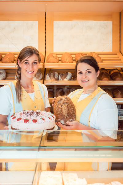 Sales women in bakery with cake and bread Stock photo © Kzenon