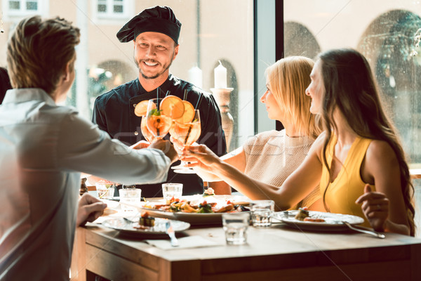 опытный повар четыре человека модный ресторан улыбаясь Сток-фото © Kzenon