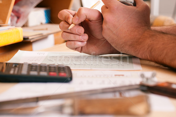 Carpenter planning his work  Stock photo © Kzenon