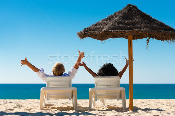 Happy couple on beach Stock photo © Kzenon