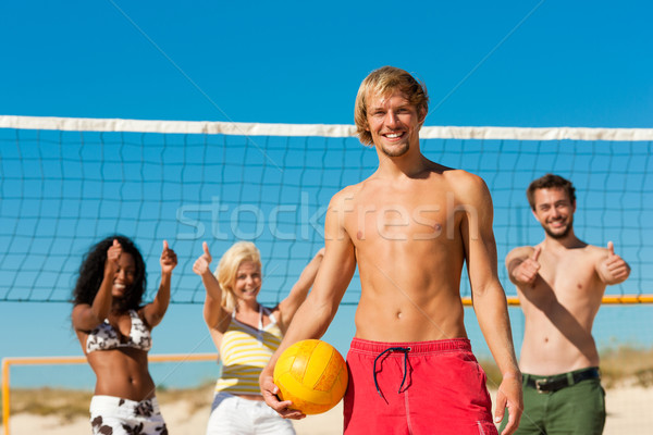Friends playing beach volleyball Stock photo © Kzenon