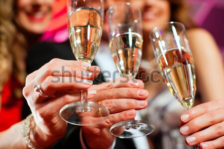 People with champagner in a bar Stock photo © Kzenon