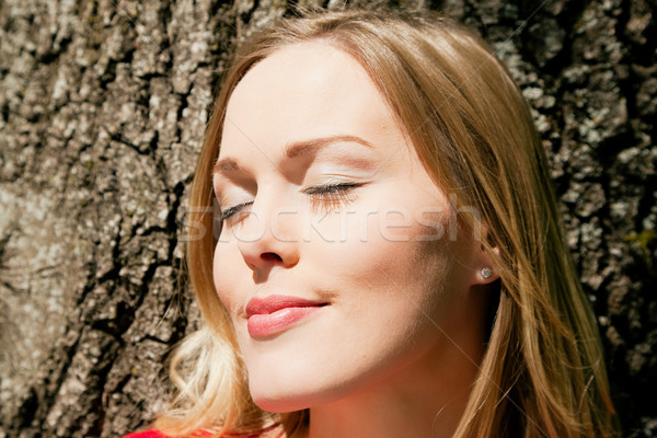 Girl standing with tree Stock photo © Kzenon