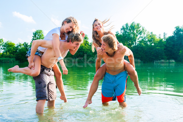 People having fun at lake in summer Stock photo © Kzenon