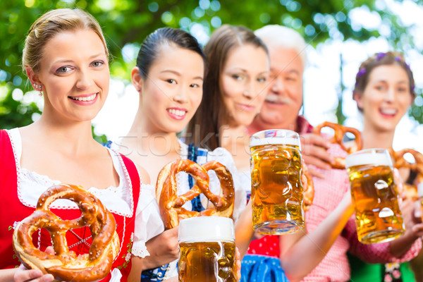 Beer garden - friends drinking in Bavaria Pub Stock photo © Kzenon
