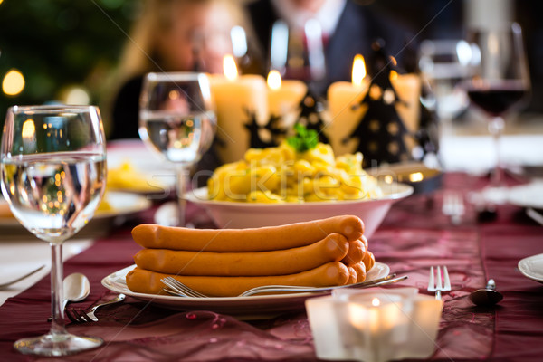 Rodziny christmas obiedzie kiełbasy sałatka ziemniaczana Zdjęcia stock © Kzenon