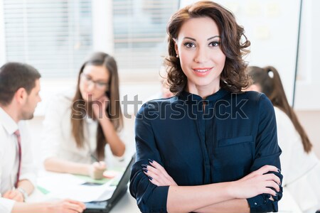 Manager with her team working in the office Stock photo © Kzenon