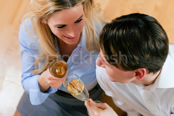 Business Couple at home with champagne Stock photo © Kzenon