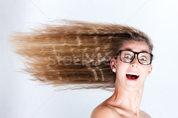 Long hair of woman blowing in head wind Stock photo © Kzenon