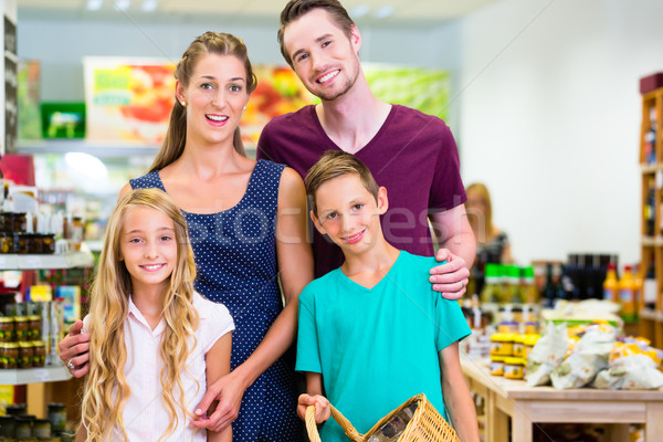 Stock photo: Family grocery shopping in corner shop