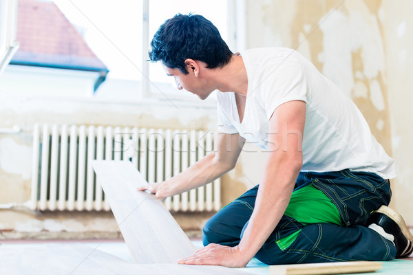 Floorer working in home in improvement project Stock photo © Kzenon