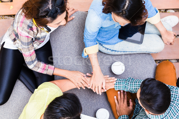 Stock photo: Young employees using modern wireless technology while working o