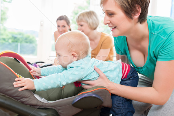 Moms and babies in mother and child course practicing Stock photo © Kzenon