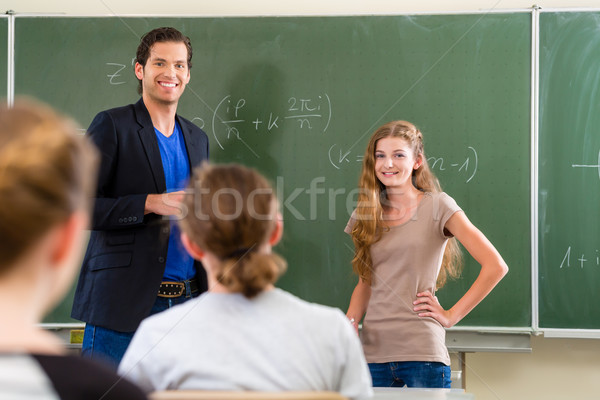 Teacher testing  student  in math lessons in school class Stock photo © Kzenon