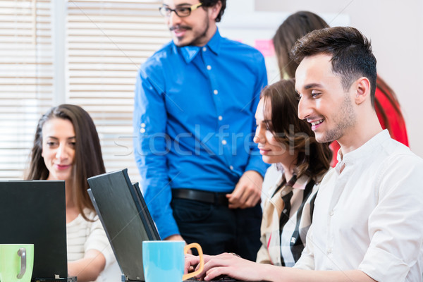 Team in creative agency discussing in meeting Stock photo © Kzenon