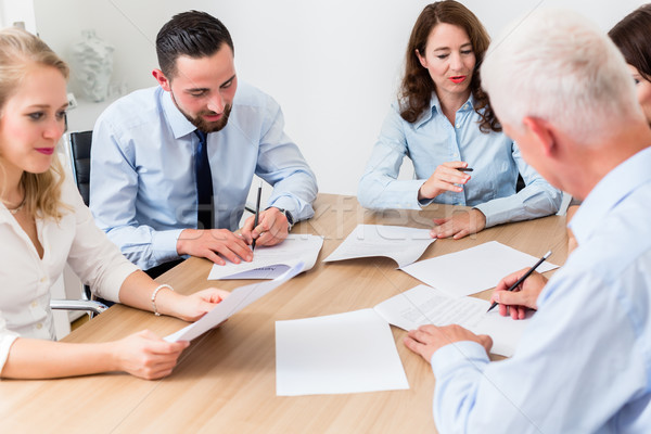 Lawyers having team meeting in law firm Stock photo © Kzenon