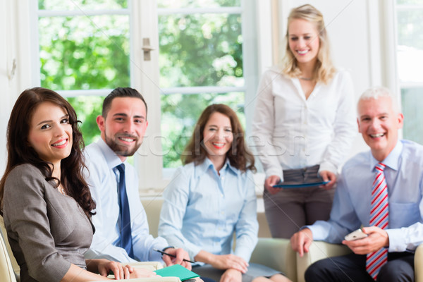 Business women and men in office having presentation  Stock photo © Kzenon