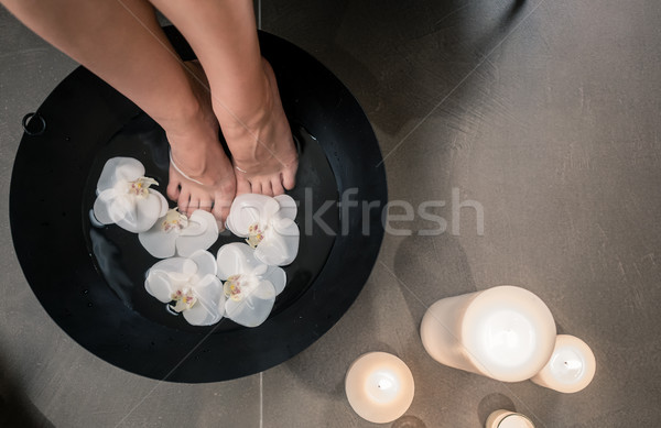 Female feet during Asian therapeutic washing at luxury beauty ce Stock photo © Kzenon