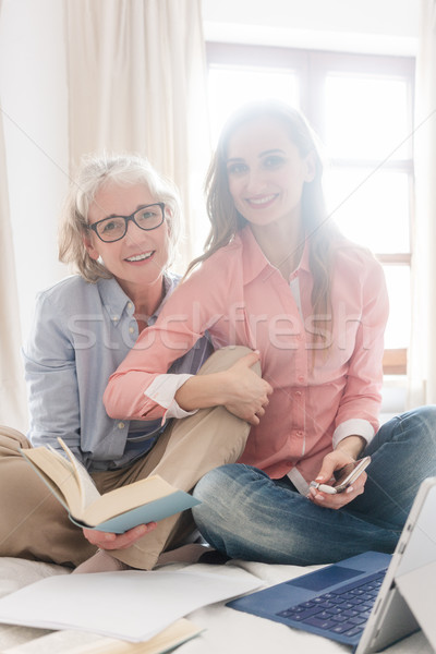 Senior and young woman working together as freelancers Stock photo © Kzenon