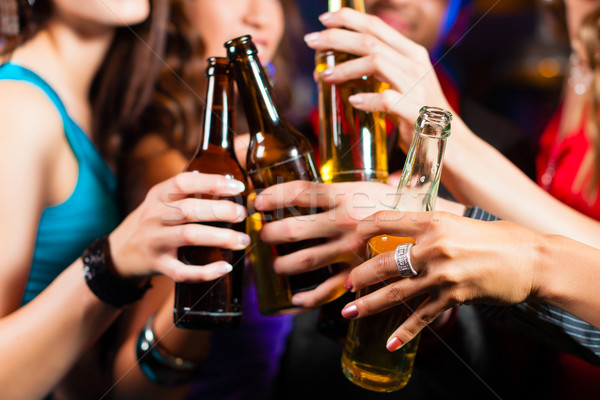 Emberek iszik sör bár klub csoport Stock fotó © Kzenon