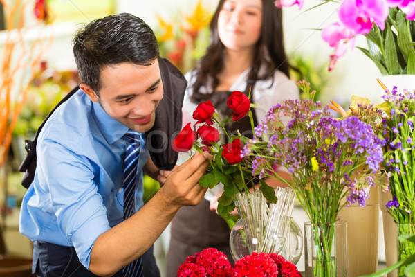 Saleswoman and customer in flower shop Stock photo © Kzenon