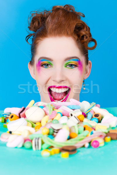 Girl with sweet goodies and candy Stock photo © Kzenon