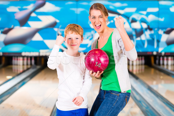 Mother and son playing together at bowling center Stock photo © Kzenon