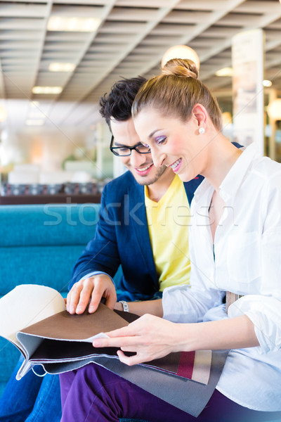 Couple picking couch seat cover in furniture store Stock photo © Kzenon