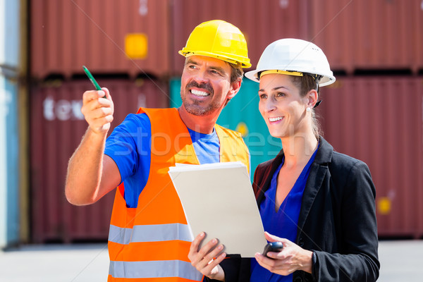 Employees in logistics company shipping containers Stock photo © Kzenon