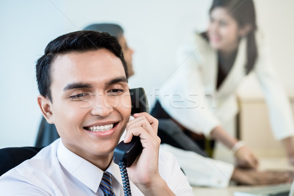 Employee in office making a business call Stock photo © Kzenon