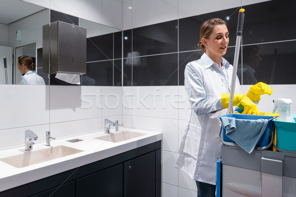 Janitor or charlady with her work tools looking at camera Stock photo © Kzenon